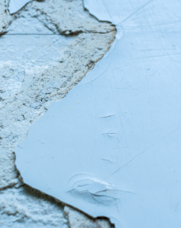 A clean image of painters working on an exterior double-storey or coastal home.